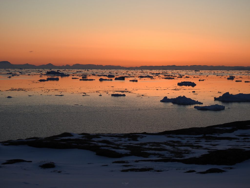 Sunset over drifting sea ice, Greenland